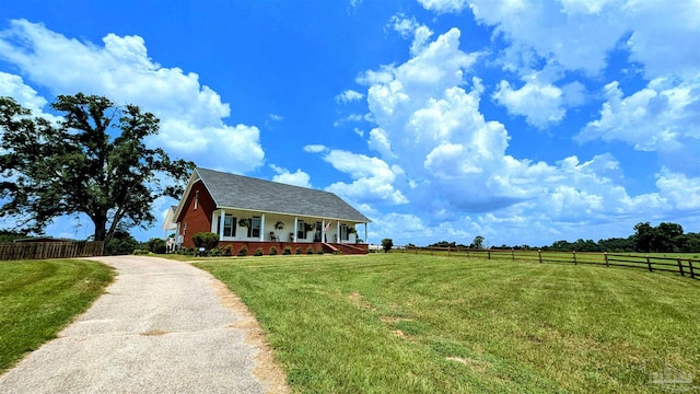 view of front of house with a porch and a front yard