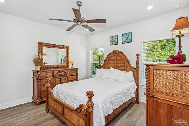 bedroom featuring ceiling fan and wood-type flooring