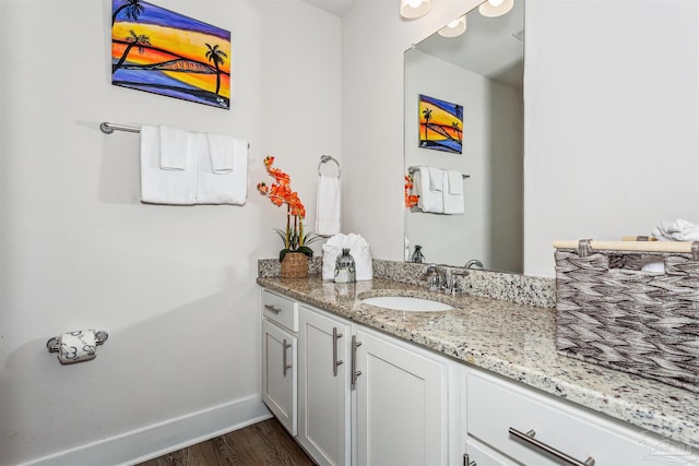 bathroom with vanity and hardwood / wood-style flooring