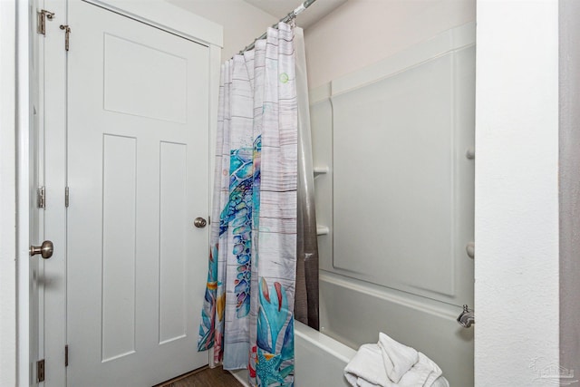 bathroom with shower / bath combo with shower curtain