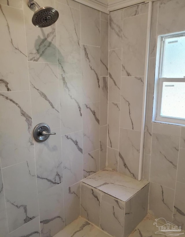 full bath with tiled shower