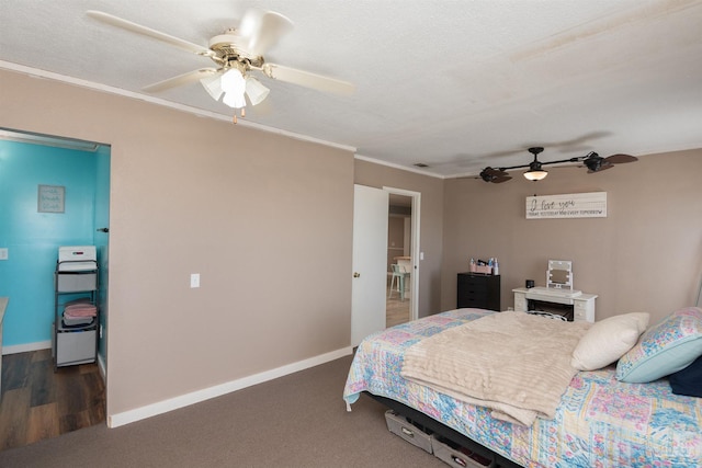 bedroom with a textured ceiling, baseboards, a ceiling fan, and ornamental molding