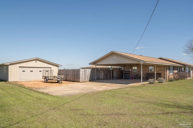 exterior space featuring an outbuilding, brick siding, a yard, fence, and a garage