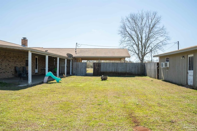 view of yard featuring a fenced backyard, cooling unit, and a patio