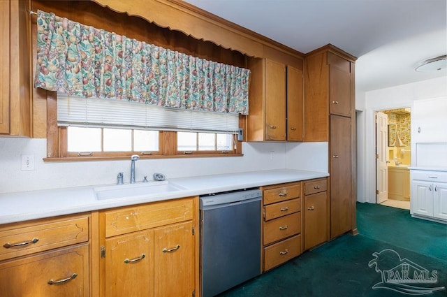 kitchen featuring sink, dishwasher, and dark carpet