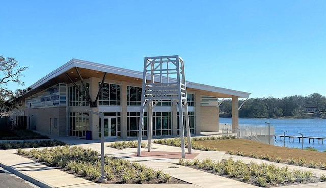 view of building exterior with a water view