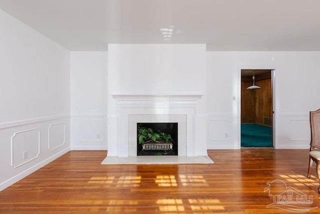 unfurnished living room with wood-type flooring