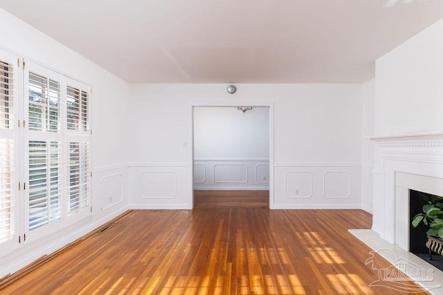 unfurnished living room with hardwood / wood-style floors