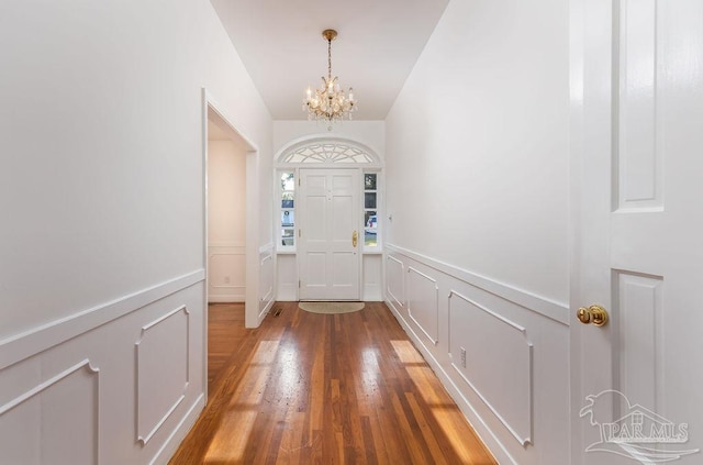 entryway featuring a notable chandelier and hardwood / wood-style floors