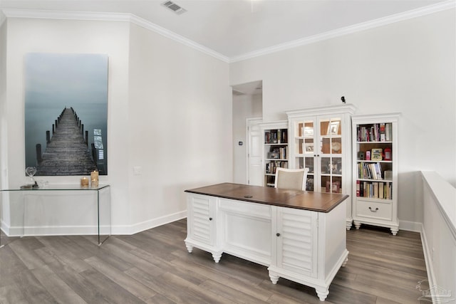 home office featuring crown molding and dark hardwood / wood-style floors