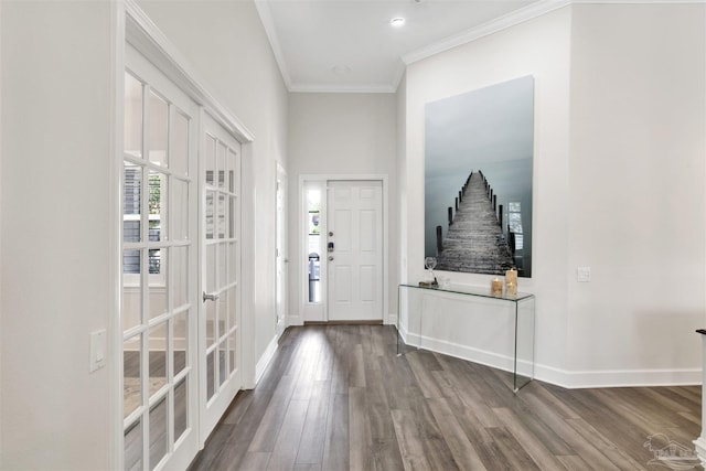 entryway featuring hardwood / wood-style floors, ornamental molding, and french doors