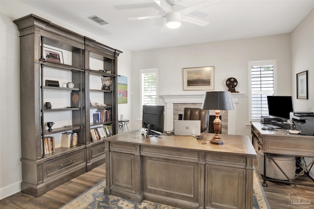 office with ceiling fan, a wealth of natural light, and dark hardwood / wood-style flooring