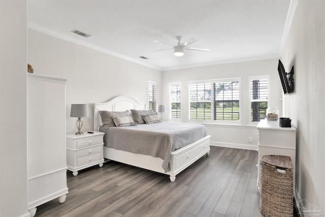 bedroom featuring crown molding, dark hardwood / wood-style flooring, and ceiling fan