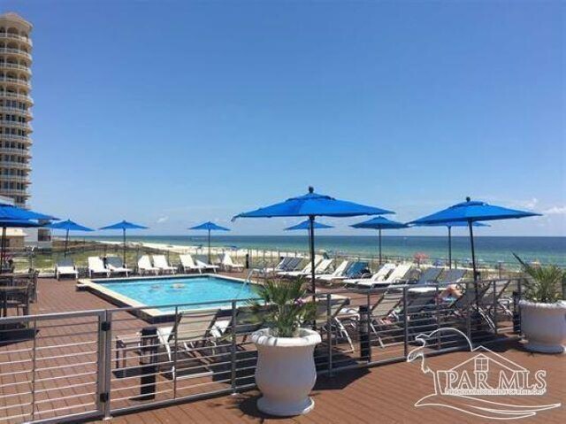 view of pool featuring a water view