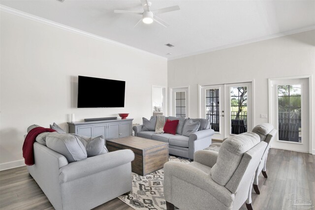 living room featuring ornamental molding, hardwood / wood-style flooring, french doors, and ceiling fan