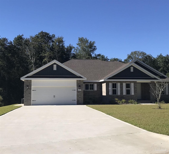 view of front facade with a garage, a front lawn, brick siding, and driveway