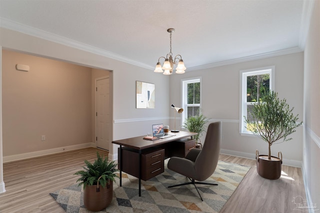 office space with a chandelier, crown molding, baseboards, and light wood-type flooring