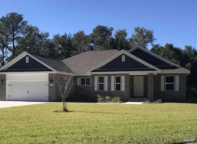 craftsman-style home featuring a garage and a front lawn