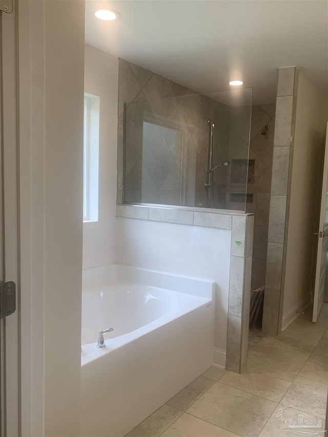 bathroom featuring tile patterned flooring and plus walk in shower