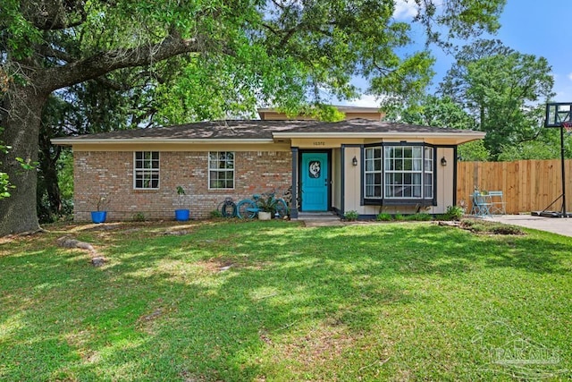 10370 Bowman Ave, Pensacola, FL 32534 - ranch-style home featuring brick siding, a front lawn, and fence