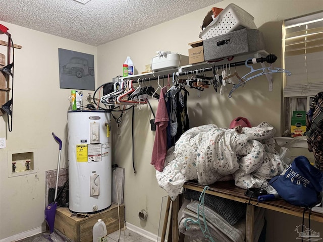 spacious closet featuring water heater