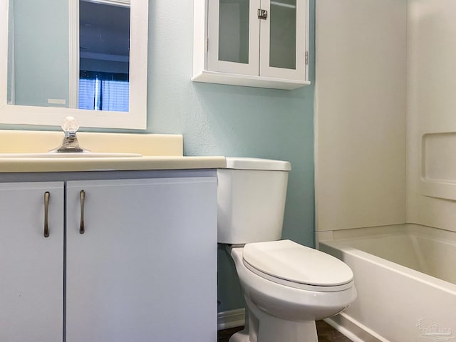 bathroom with toilet and vanity