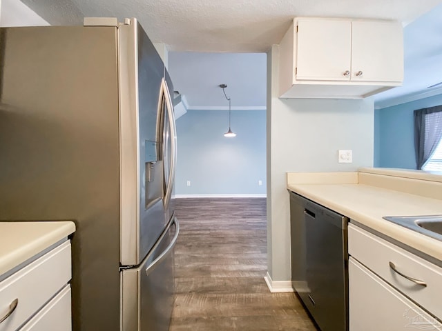 kitchen with dark wood-style floors, light countertops, appliances with stainless steel finishes, white cabinetry, and baseboards