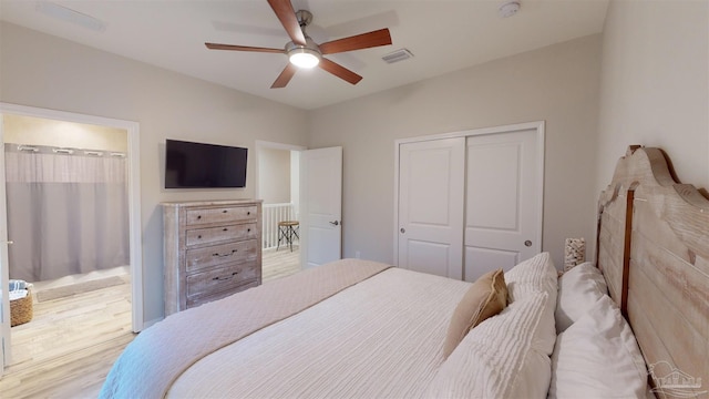 bedroom featuring light hardwood / wood-style floors, a closet, and ceiling fan