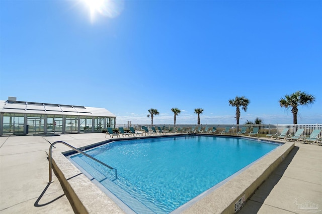 view of swimming pool featuring a patio area