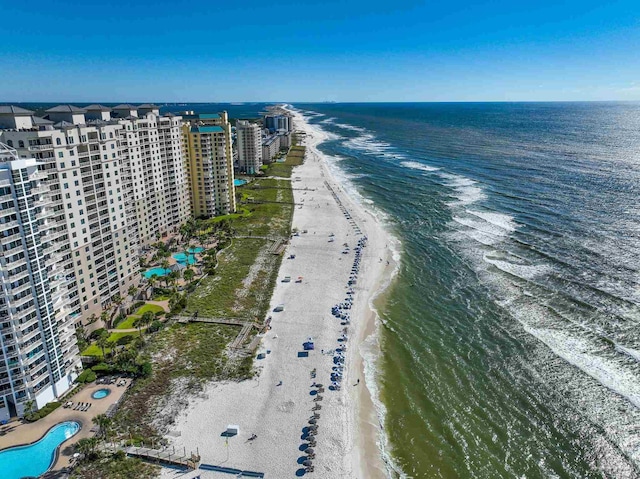 aerial view with a water view and a beach view