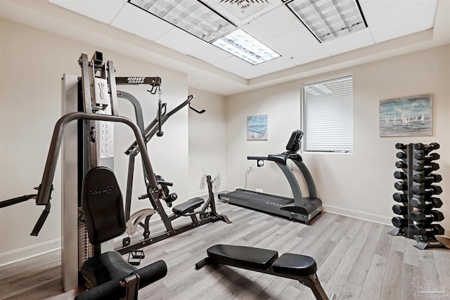 workout area with light wood-type flooring