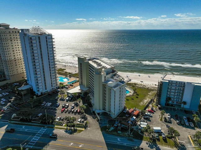 aerial view with a water view and a view of the beach