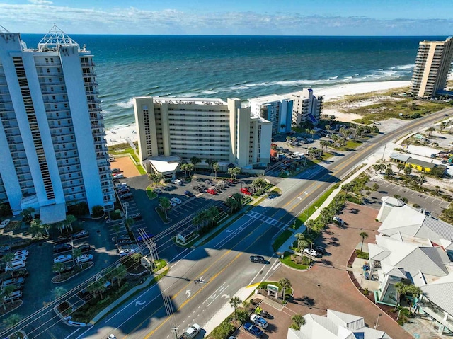 aerial view with a water view and a view of the beach