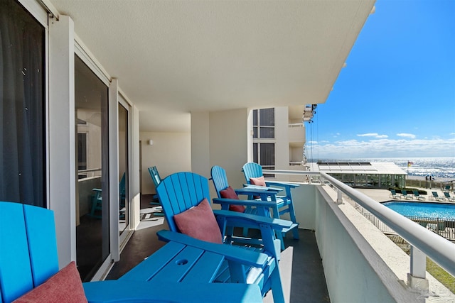 balcony featuring a water view