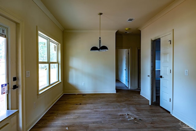 unfurnished dining area with visible vents, baseboards, dark wood-style floors, and ornamental molding