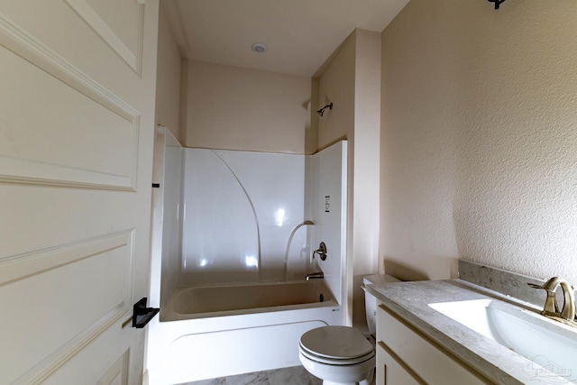 full bathroom with a textured wall, shower / tub combination, vanity, and toilet