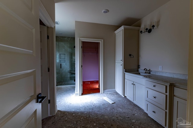 full bathroom featuring a spacious closet, visible vents, a shower stall, and vanity