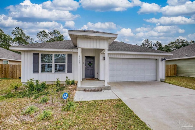 single story home with a garage, fence, driveway, and a shingled roof