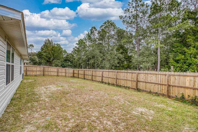 view of yard with a fenced backyard