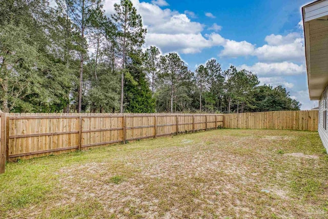 view of yard featuring a fenced backyard