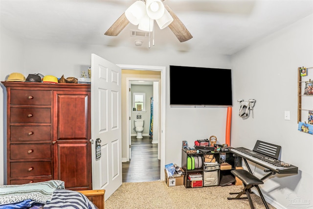 bedroom with a ceiling fan, visible vents, and carpet