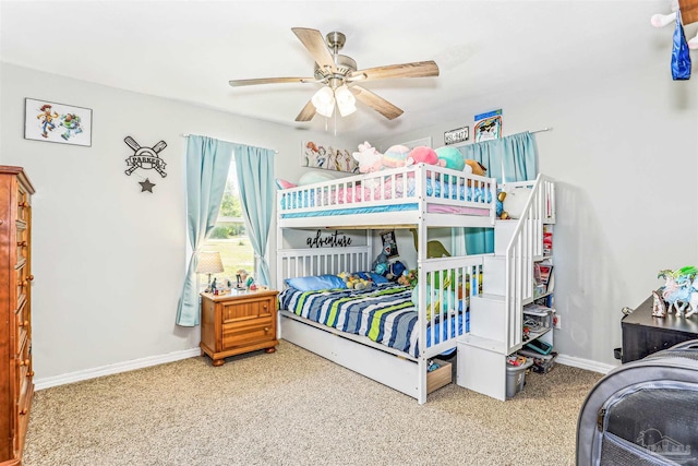 bedroom featuring baseboards, a ceiling fan, and carpet flooring