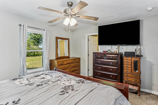 bedroom with baseboards, a ceiling fan, and carpet flooring