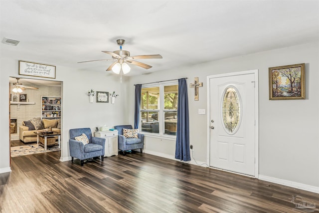 entryway with baseboards, wood finished floors, visible vents, and ceiling fan