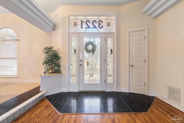 foyer featuring wood-type flooring