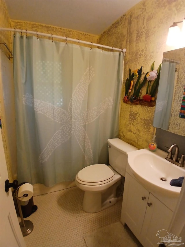 bathroom featuring vanity, tile patterned flooring, toilet, and a shower with shower curtain