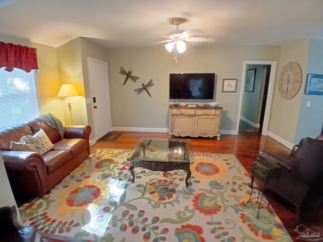 living room with ceiling fan and light hardwood / wood-style flooring