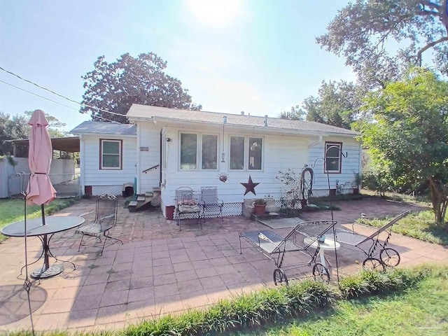 rear view of property with a patio