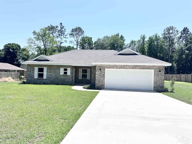 6283 Andys Ln, Milton, FL 32570 - single story home featuring brick siding, a garage, driveway, and roof with shingles
