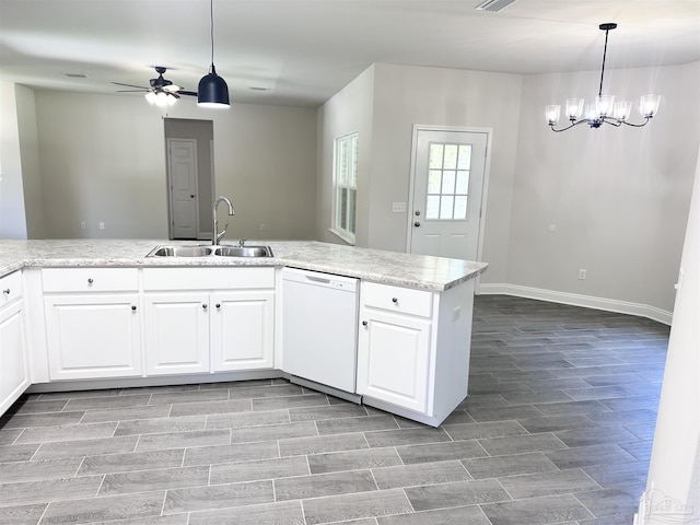 6283 Andys Ln, Milton, FL 32570 - kitchen with white dishwasher, a sink, a ceiling fan, wood finish floors, and a chandelier